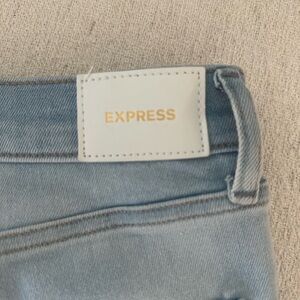 Express Blue Jeans with Faded Wash and Visible Stitching